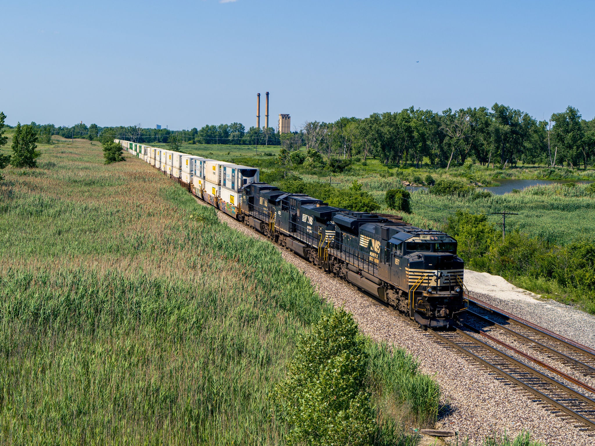 Genset energy efficient train cars pulling grain cars