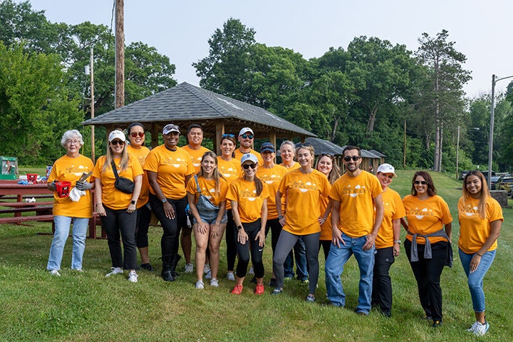 Norfolk Southern employees walking in a community  