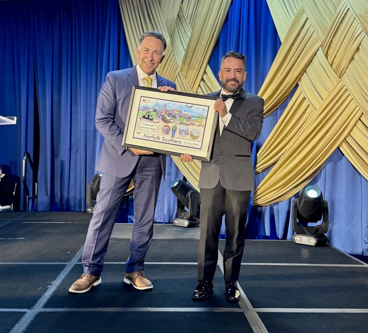 Mark George accepting Corporate Hero of the Year Award